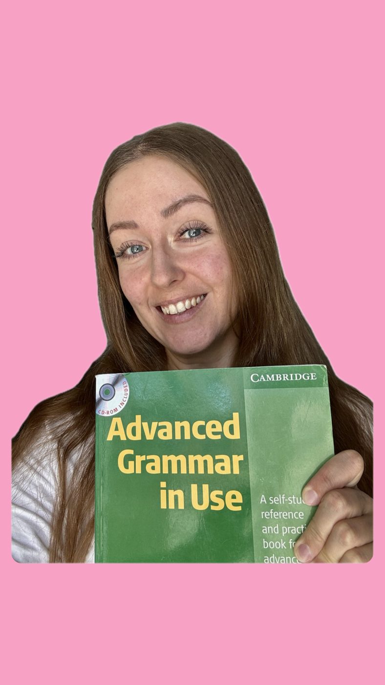 Vanda, online English teacher, holding the Advanced Grammar in Use book